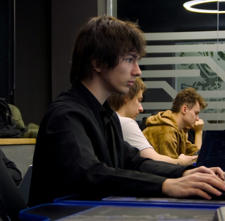 College student using a laptop during class, illustrating flipped classroom research