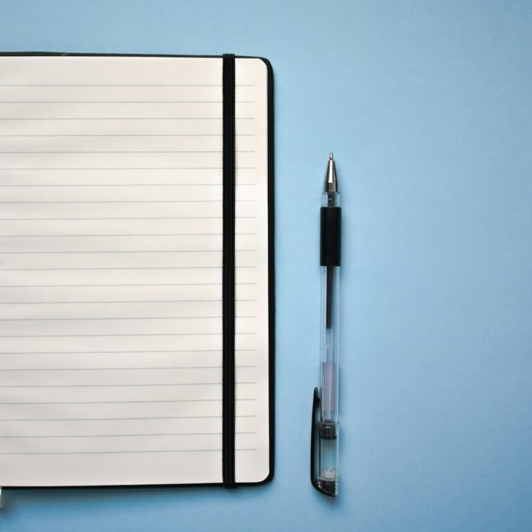 Notebook and pen for a Metaphor Mingle poetry lesson plan