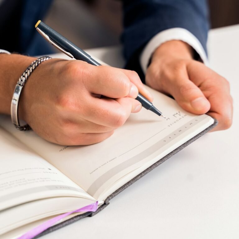 Person writing in a journal for a short- and long-term goals life management lesson