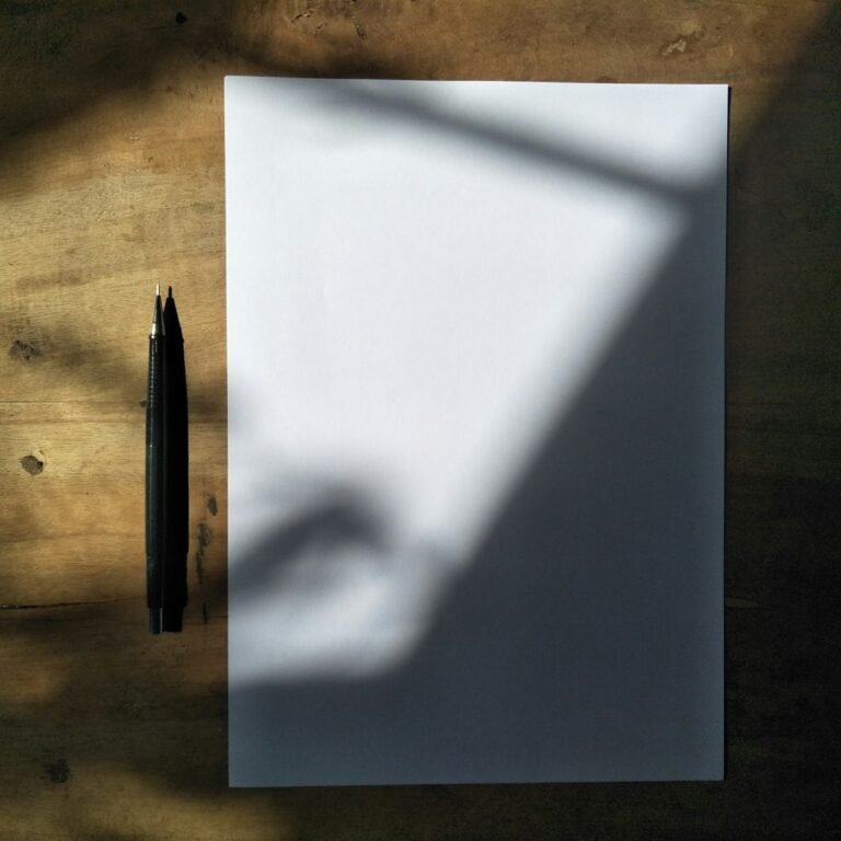 Pen and paper for practicing PEEL paragraphs