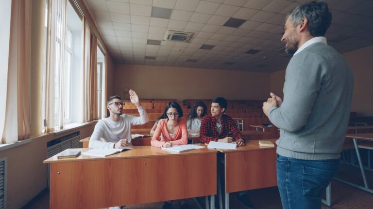 Teacher working with students on classroom questions