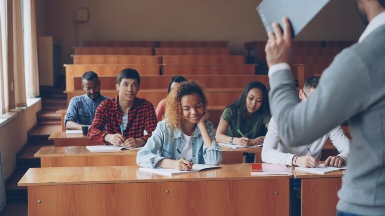 Students listening and writing during an English lesson