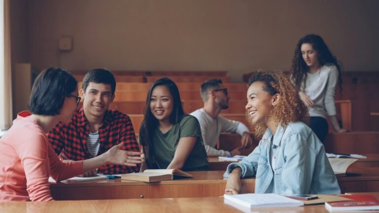 Students discussing study strategies in a classroom