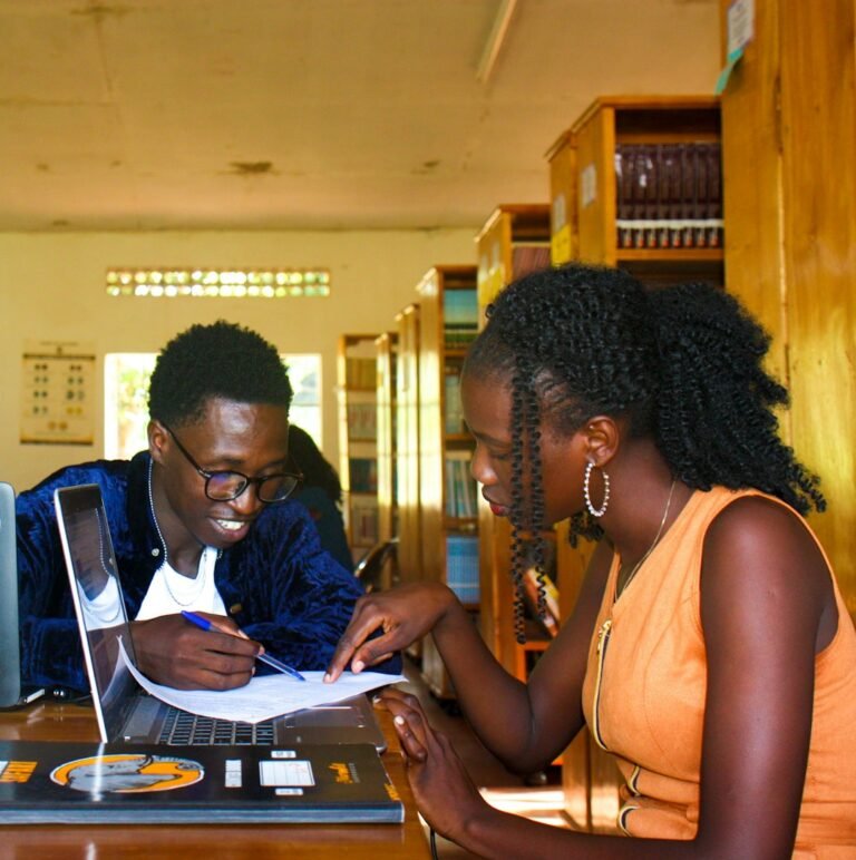 People discussing ideas in a library, illustrating verbal and nonverbal communication
