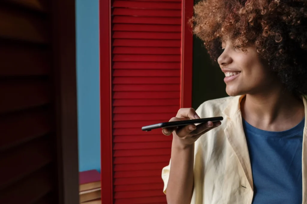A woman speaking into an ai-powered phone.